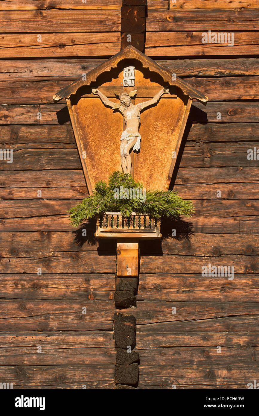 Wooden cross, shrine, decorated with mountain pine, Nonsalm, Weerberg, Tyrol, Austria Stock Photo