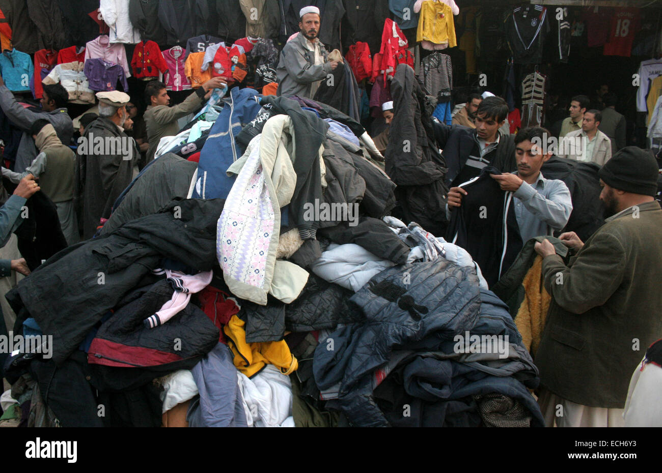 Peshawar Pakistan. 15th Dec 2014. People buy winter clothes at a market in Peshawar Pakistan Dec. 15 2014. Ahmad Sidique Xinhua Alamy Live News Stock Photo Alamy