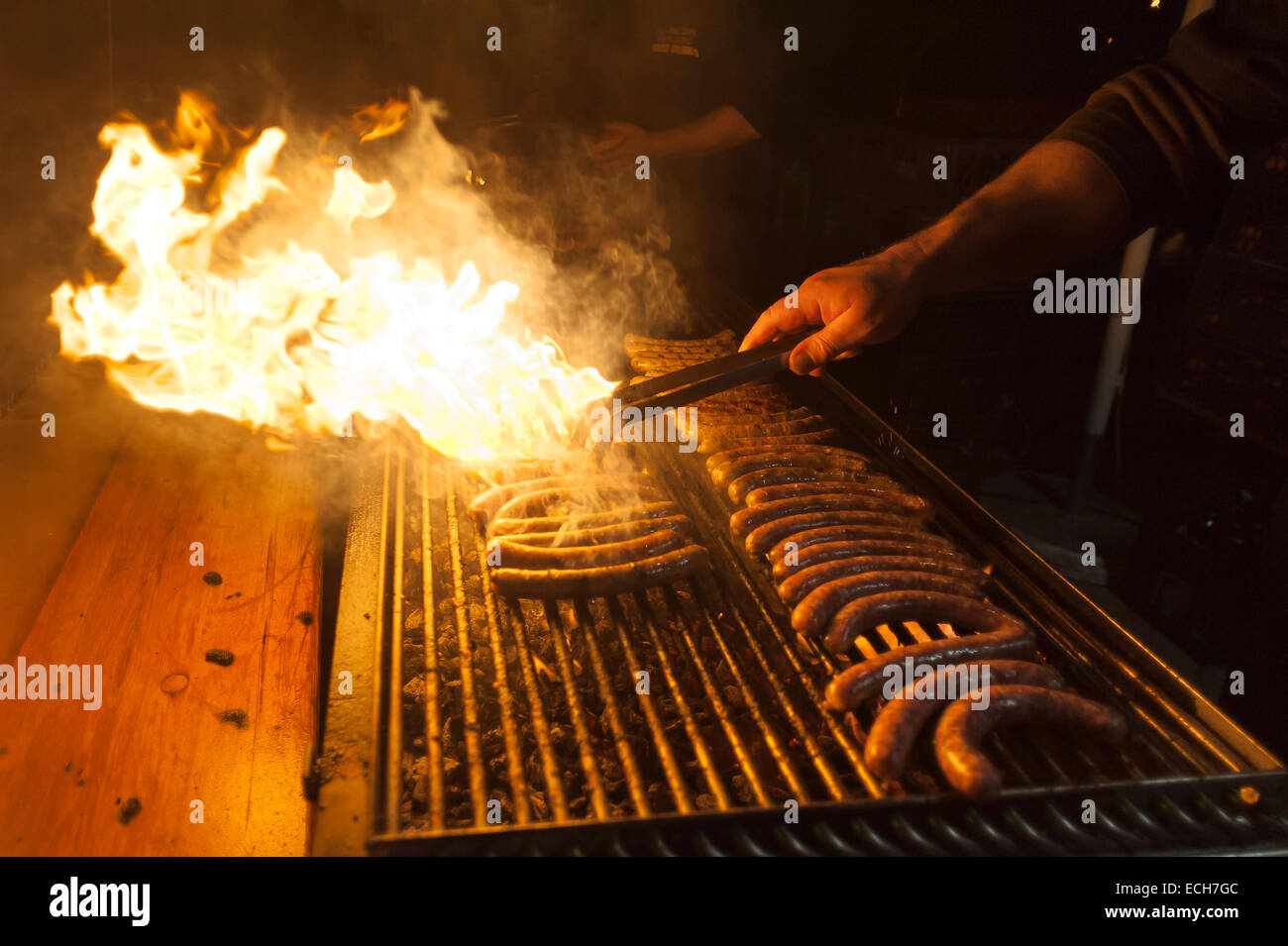 Sausages on a barbecue grill with flames, Christmas market, Bavaria, Germany Stock Photo