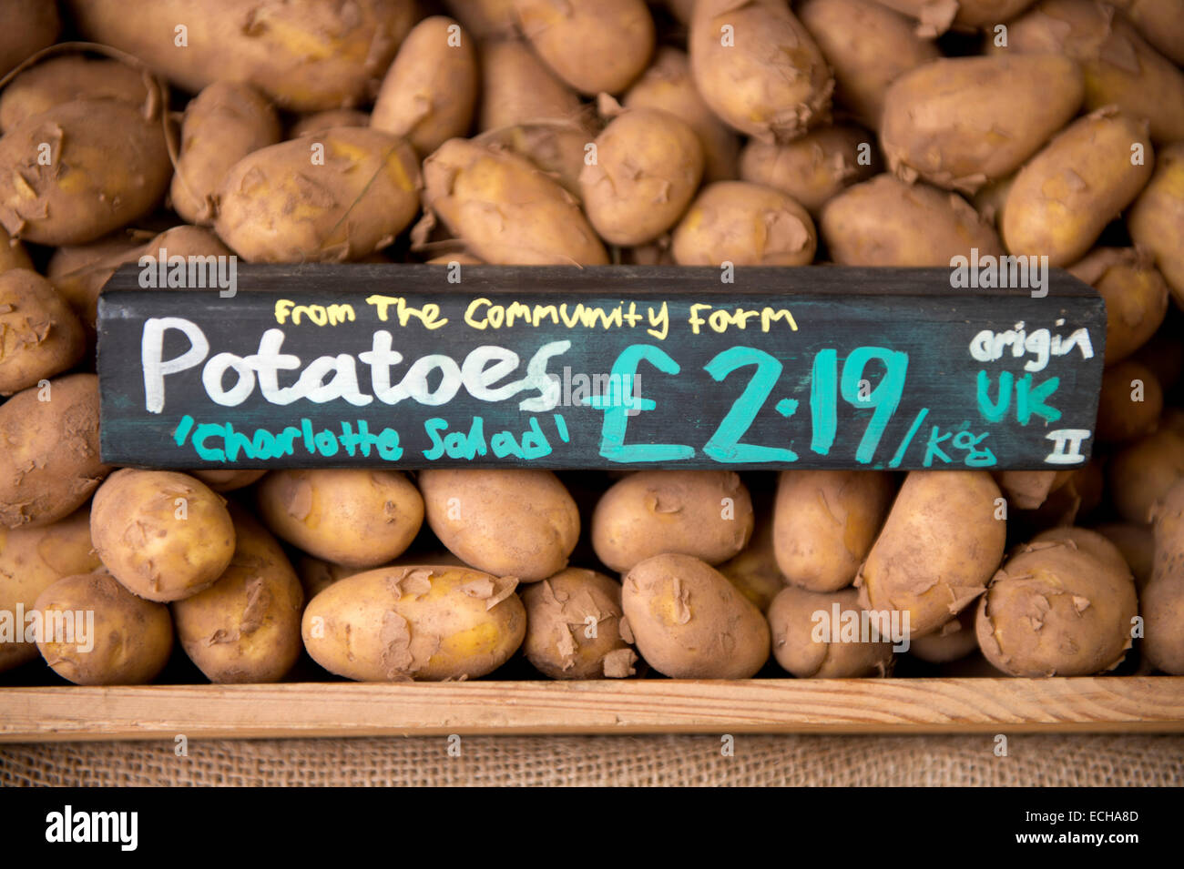 Locally grown potatoes from a community farm in an organic supermarket UK Stock Photo