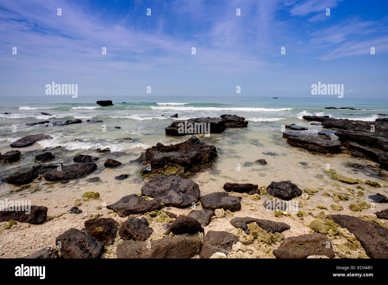 Tropical seascape - rocks , sea and blue sky Stock Photo