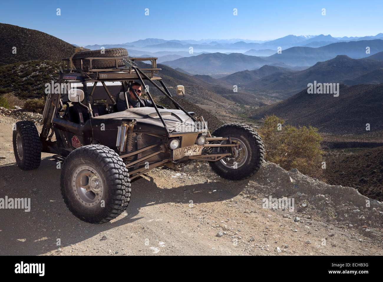 Baja 1000 race car belonging to 'The Gentleman Driver' company on a road overlooking Las Chinchillas National Reserve. Coquimbo Stock Photo