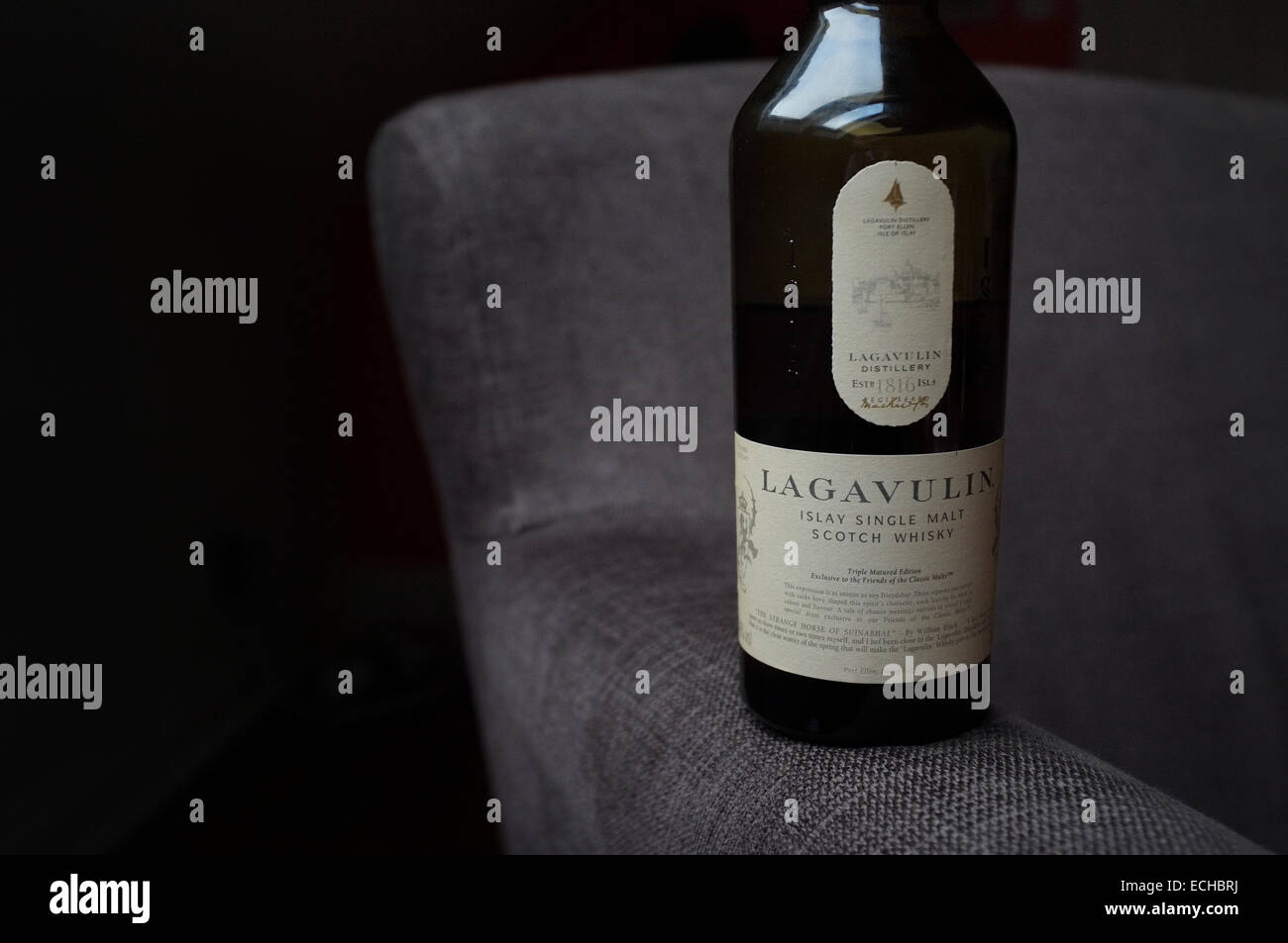 A close up horizontal view of a bottle of rare special edition Lagavulin Scotch Single Malt Whisky. Stock Photo