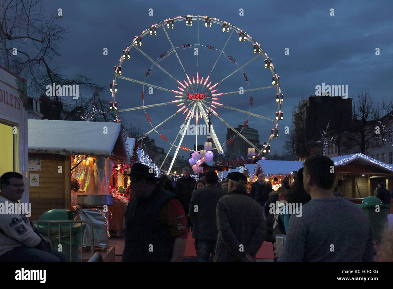 christmas market lights and ferris wheel in brussels belgium Stock