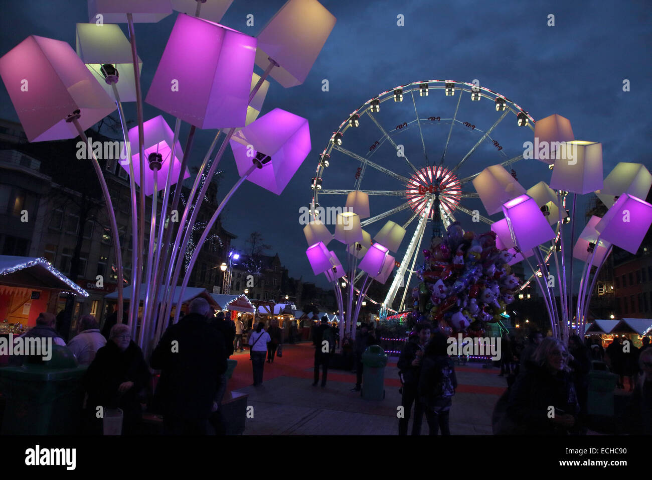 christmas market lights and ferris wheel in brussels belgium Stock