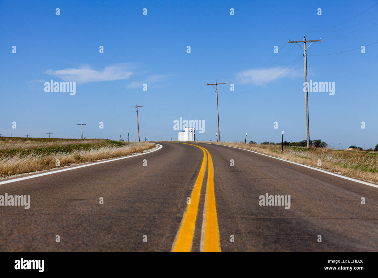 A highway on the Great Plains going west near Hope, Kansas, USA Stock Photo