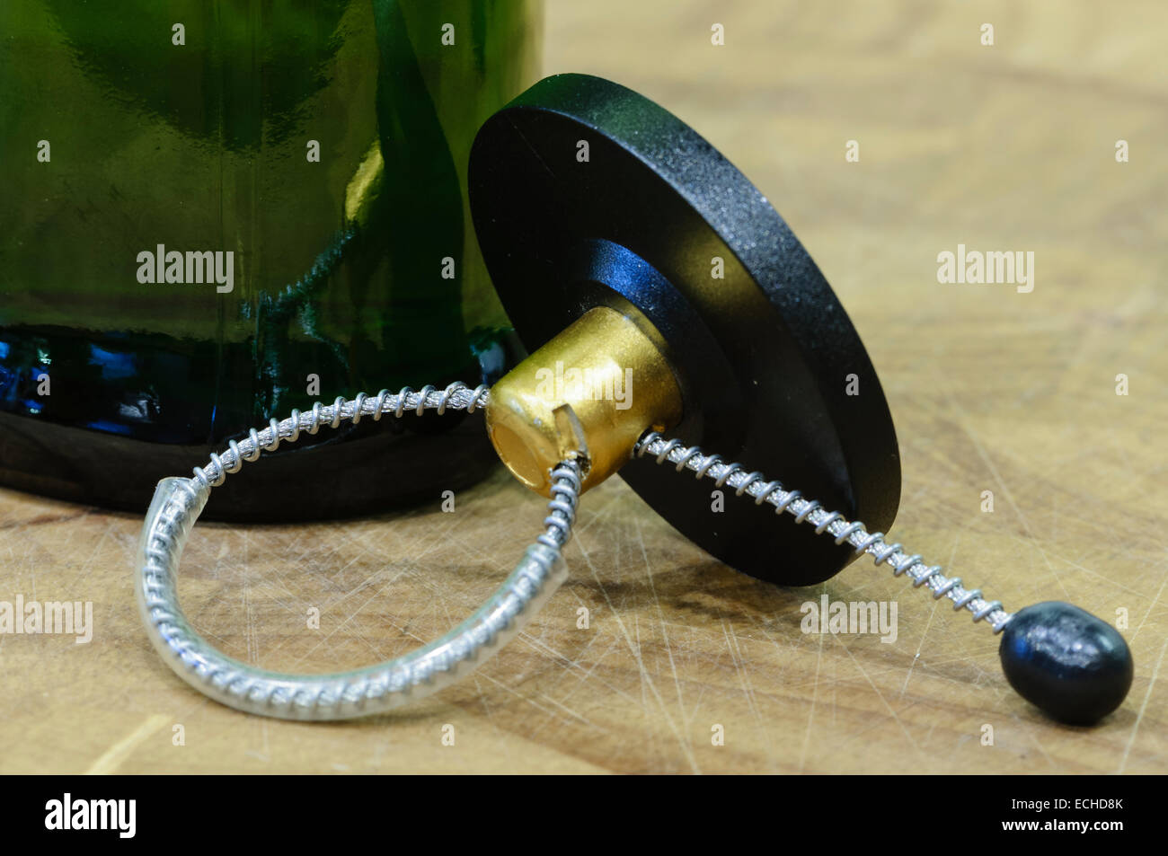 A security tag removed from a bottle lies on a table Stock Photo Alamy