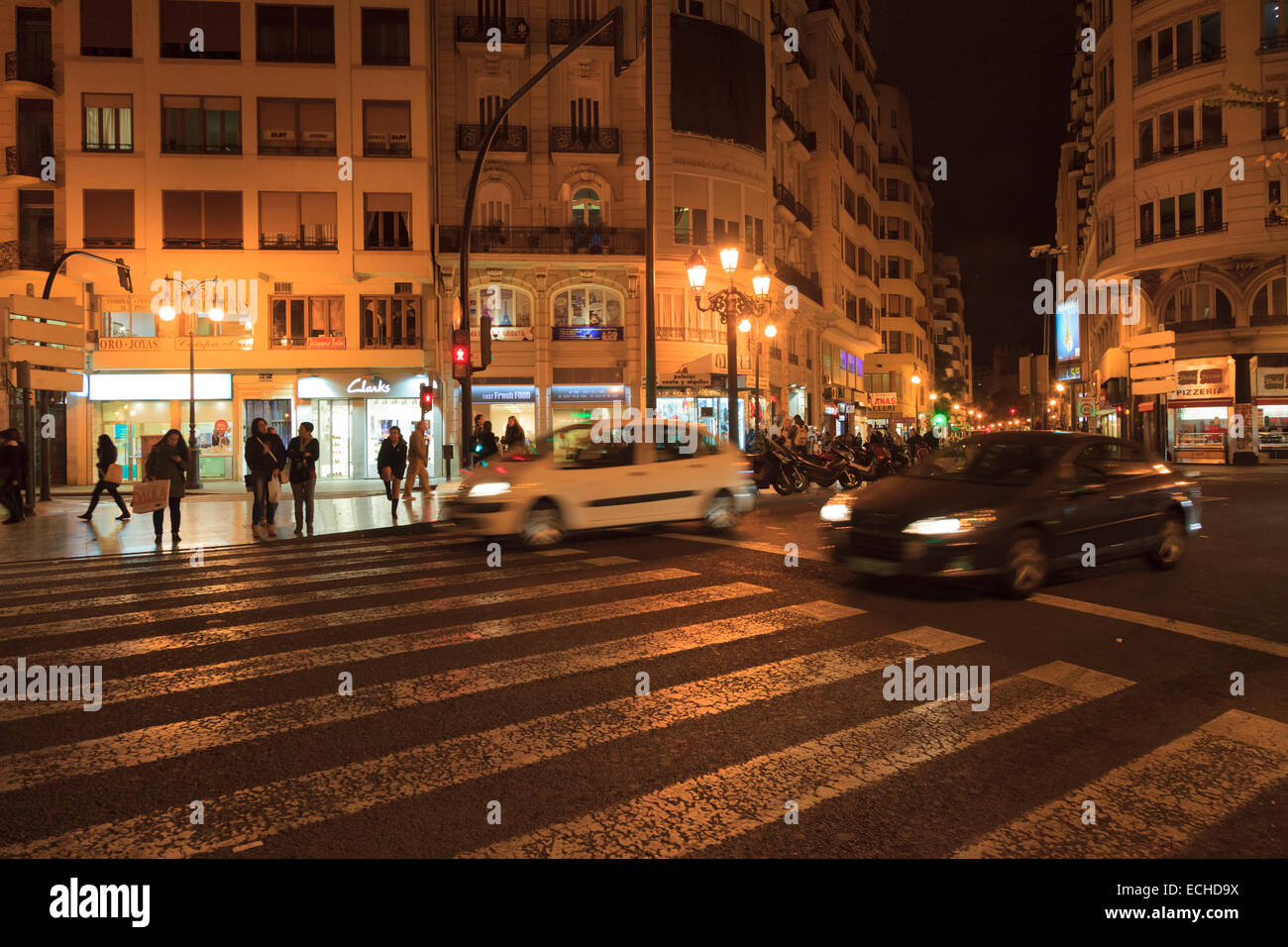 Cars speeding across pedestrain crossing in city centre at night Stock ...