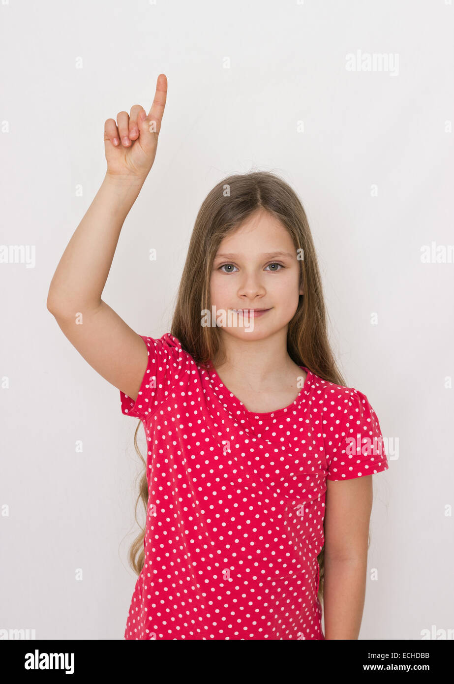 A girl raises his index finger Stock Photo