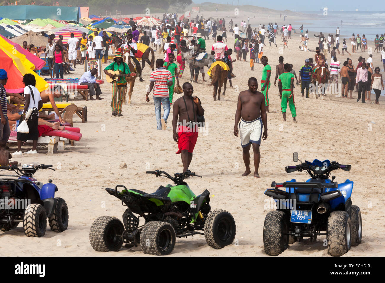 Crowds and dune buggies on Labadi beach, Accra, Ghana, Africa Stock Photo