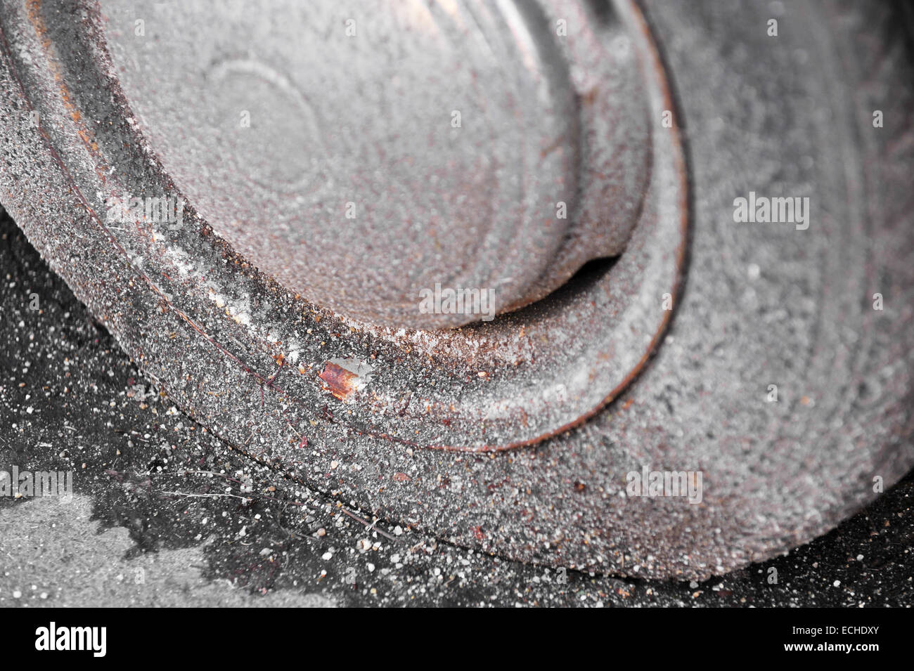 Detail shot with a old and rusty flat tire from an abandoned car Stock Photo