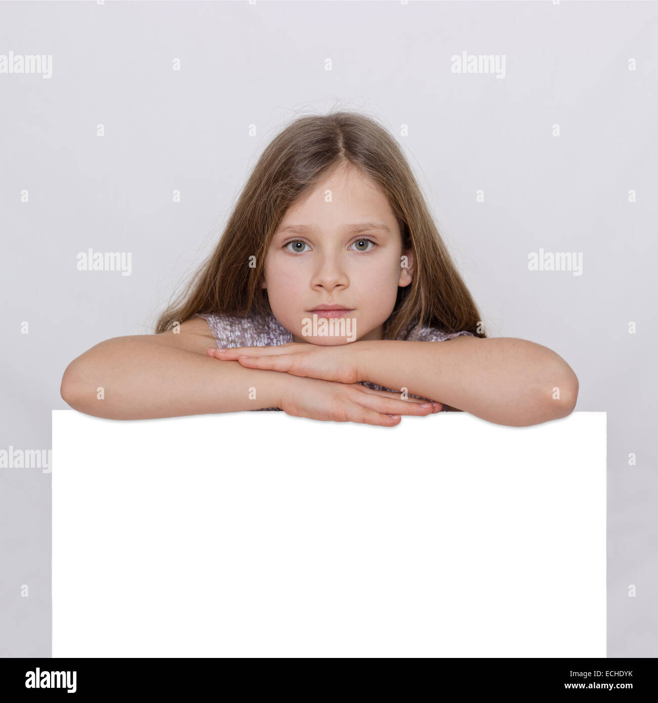 A girl shows with a white board Stock Photo