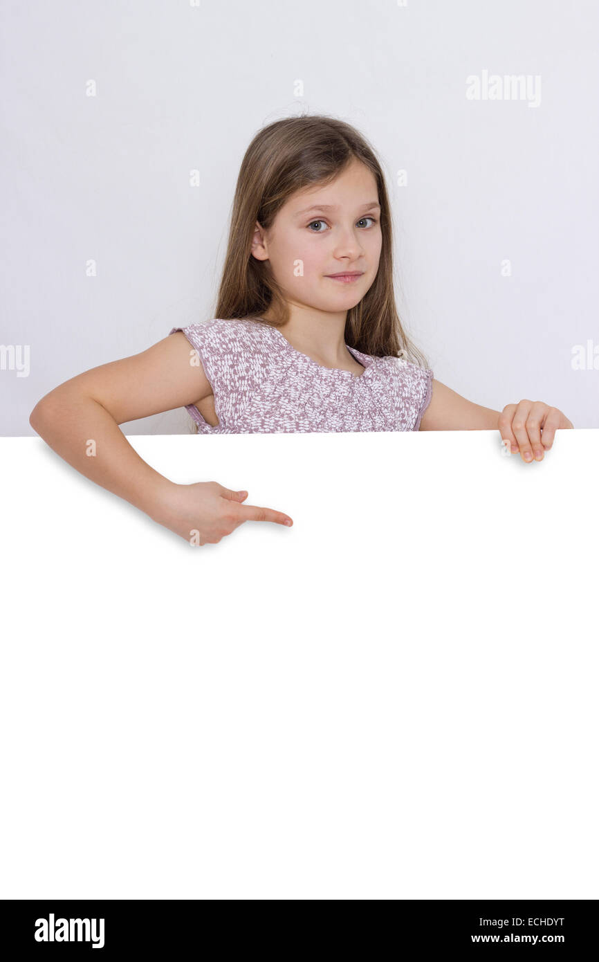 A girl shows on a white board Stock Photo