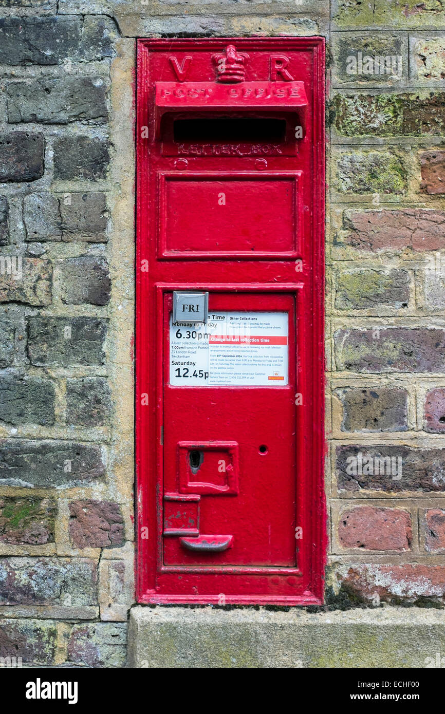 Old Red Victorian Post Box - Wall mounted mail box, London, England, UK Stock Photo