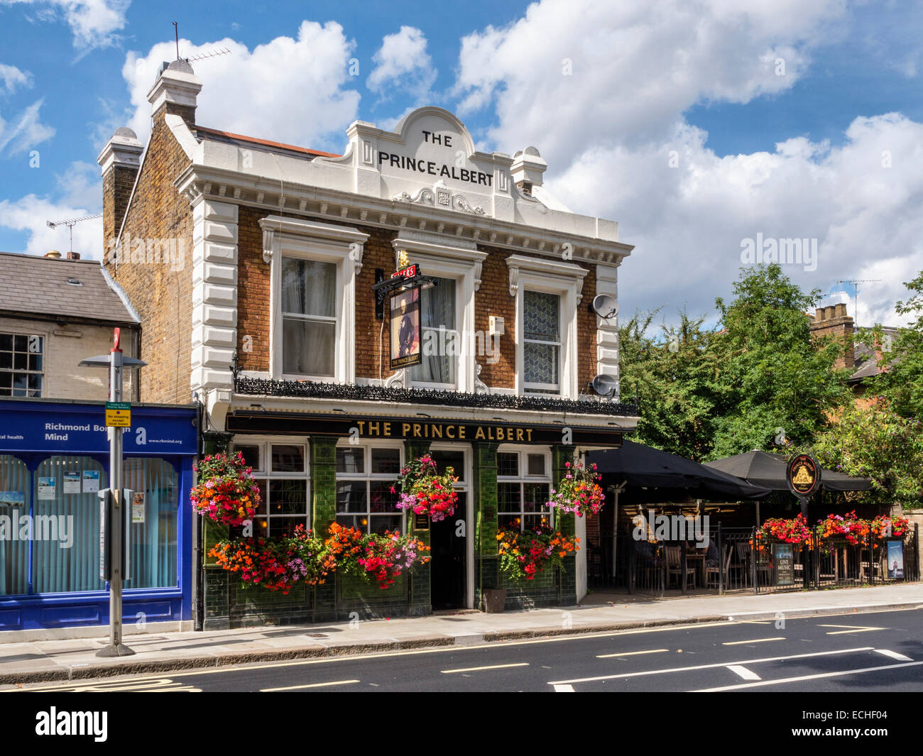 The Prince Albert - exterior of a typical traditional English pub with flower baskets in Summer, Twickenham, Greater London, UK Stock Photo