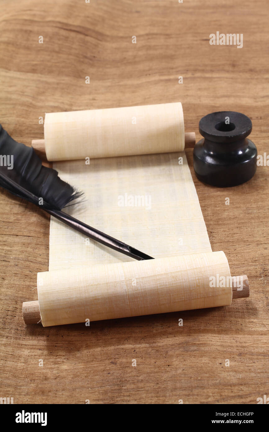Papyrus scroll with quill pen and inkwell Stock Photo
