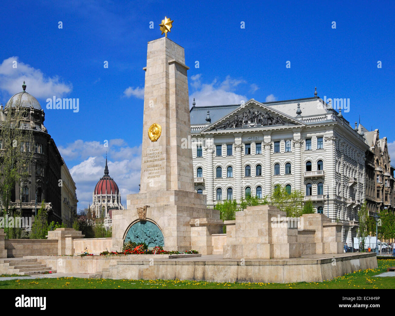 Budapest, Hungary. Szabadsag ter (square). Soviet Army Memorial. Dome of Parliament building (left); bank building Stock Photo