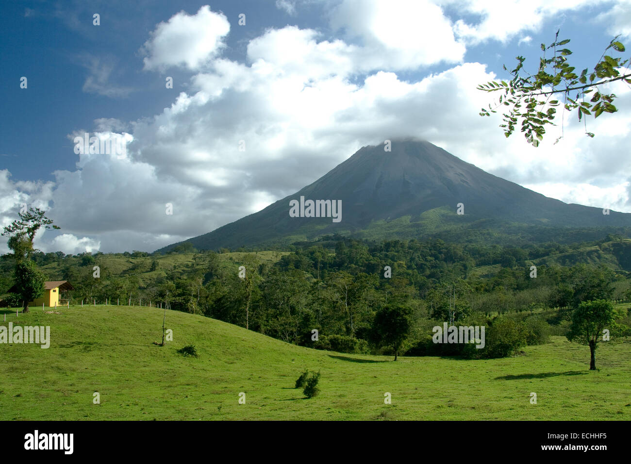 Scenic view of Arenal volcano with green countryside in foreground, Costa Rica. Stock Photo