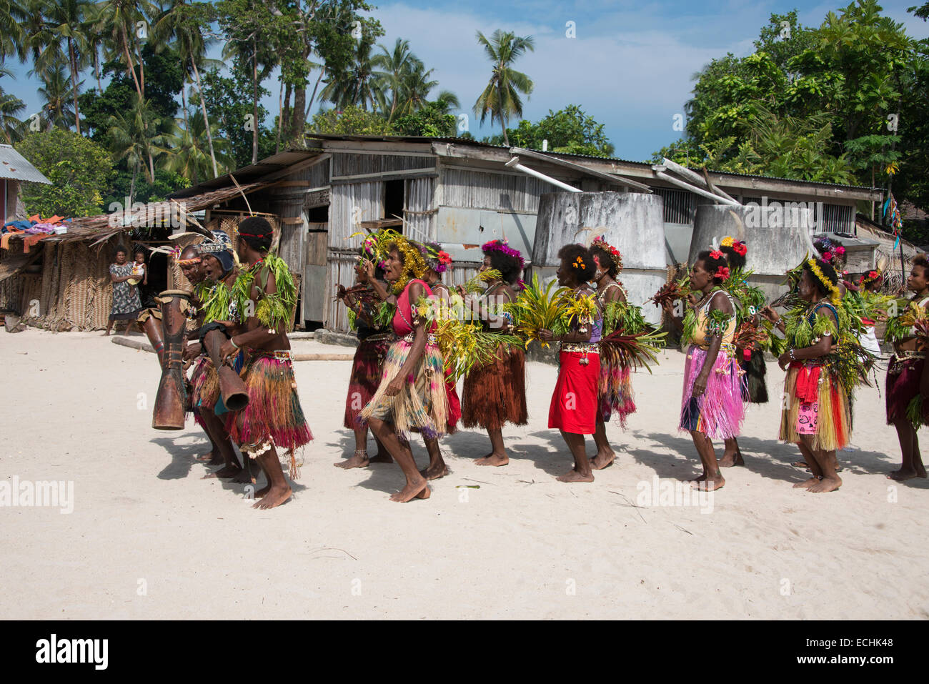 Melanesia, New Guinea, Papua New Guinea. Small island of Ali off the coast of mainland PNG. Local villagers dancing in costume. Stock Photo