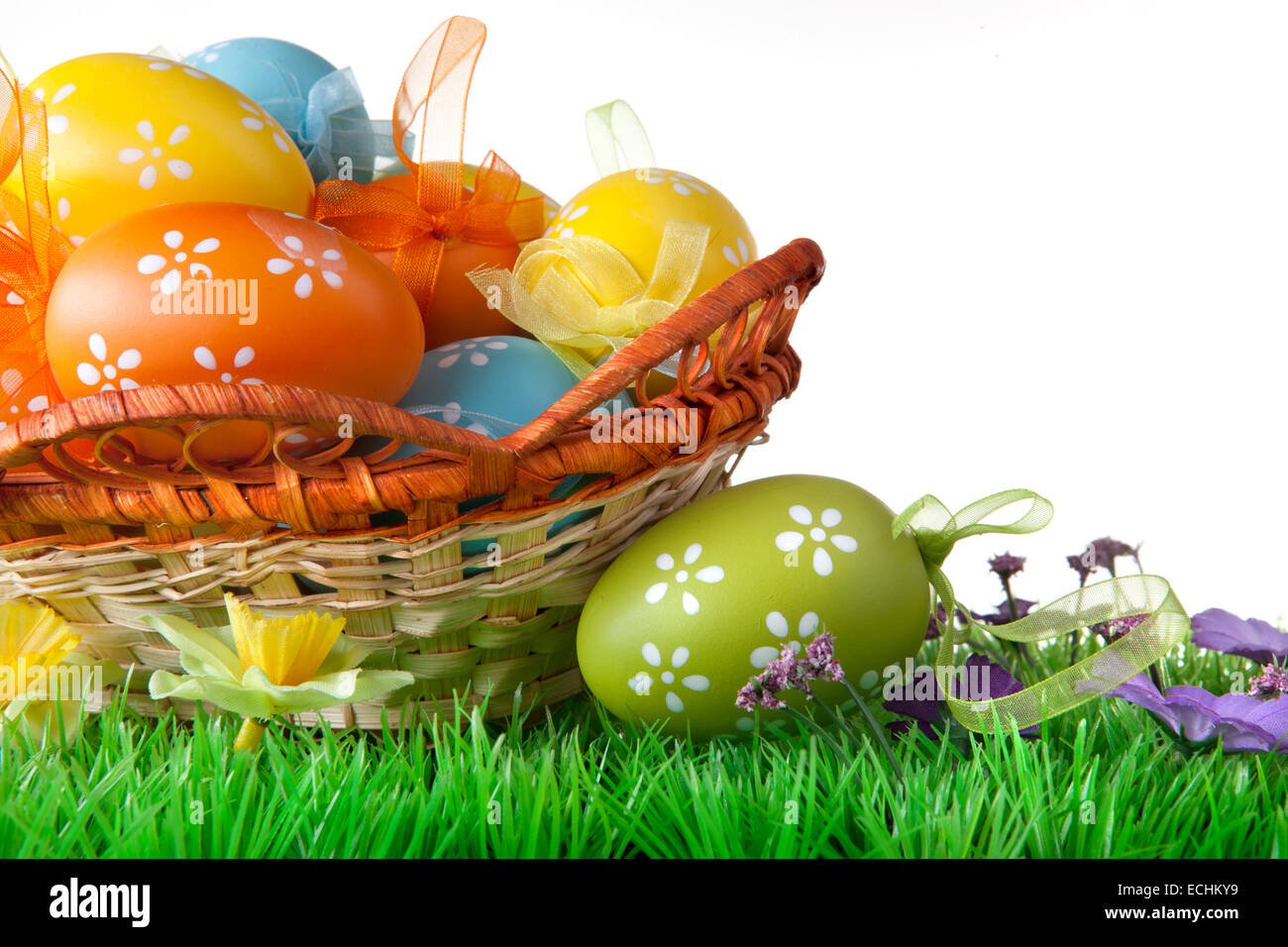 color easter eggs in basket isolated on white Stock Photo - Alamy