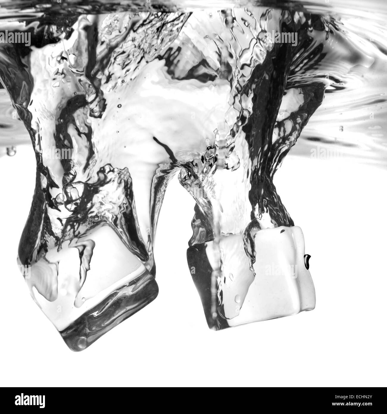 ice cubes dropped into water with splash isolated on white Stock Photo ...