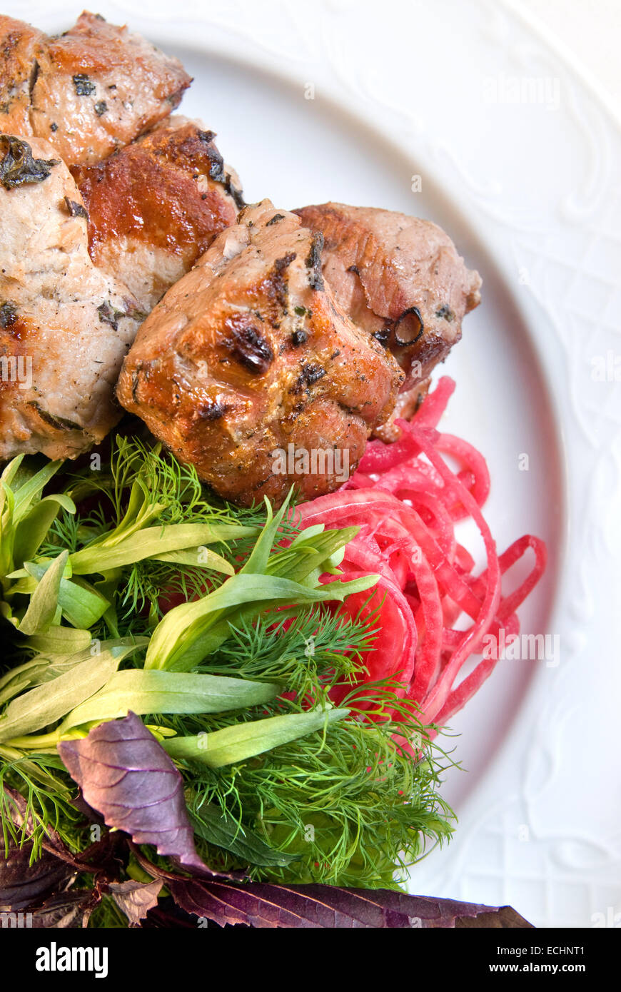 shashlik with potherbs on the plate Stock Photo