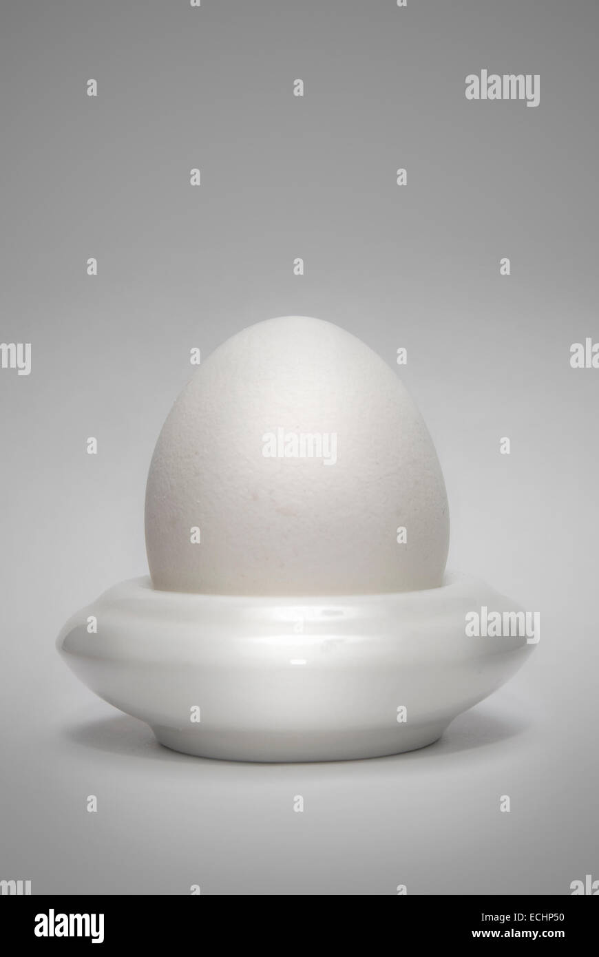 egg in the eggcup vertical Stock Photo