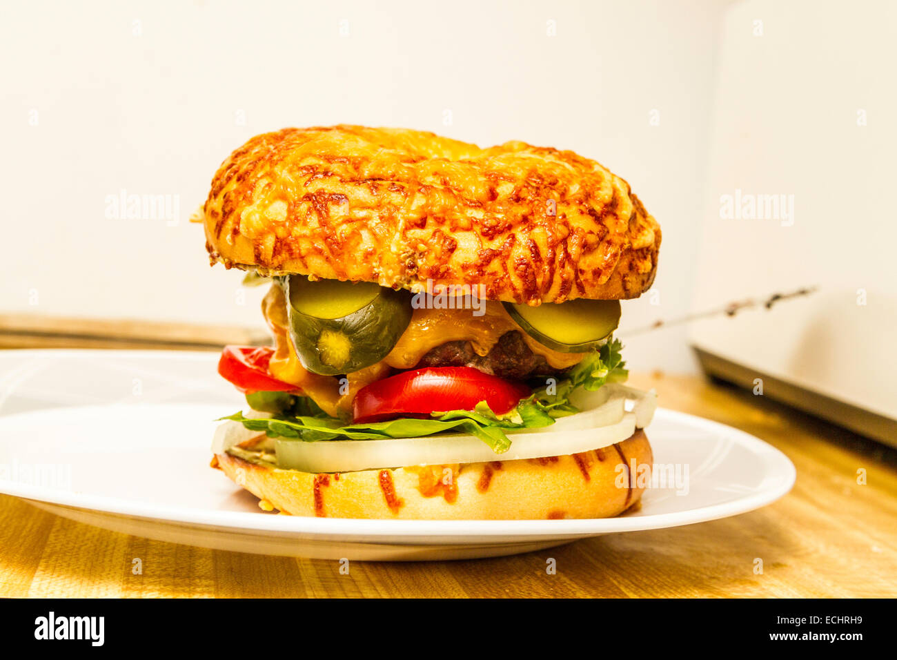 A Cheeseburger on a mozzarella cheese topped bagel Stock Photo Alamy