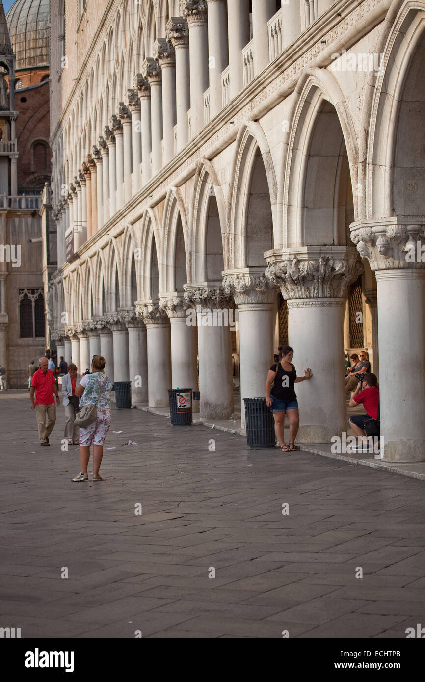 Saint marks square,Venice,the archways' of Saint Marks cathedral leading to the entrance,provide a shady spot in the heat of day Stock Photo