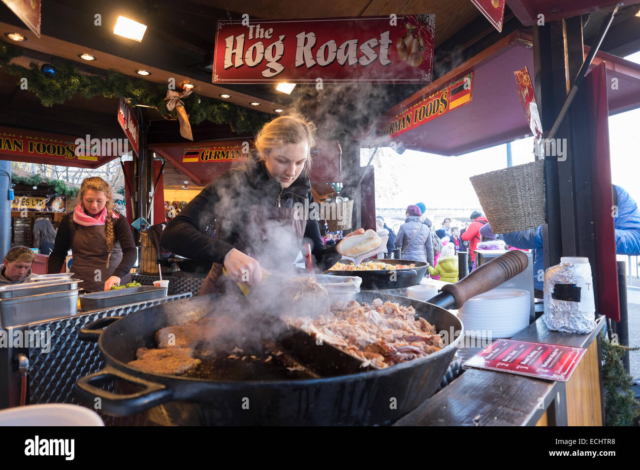 Hog roast stall at the Tate Modern Christmas Market in London, UK Stock