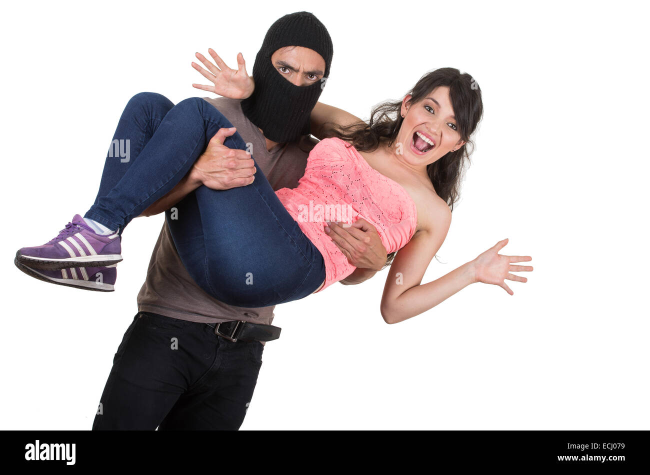 male thief kidnapping carrying young girl Stock Photo