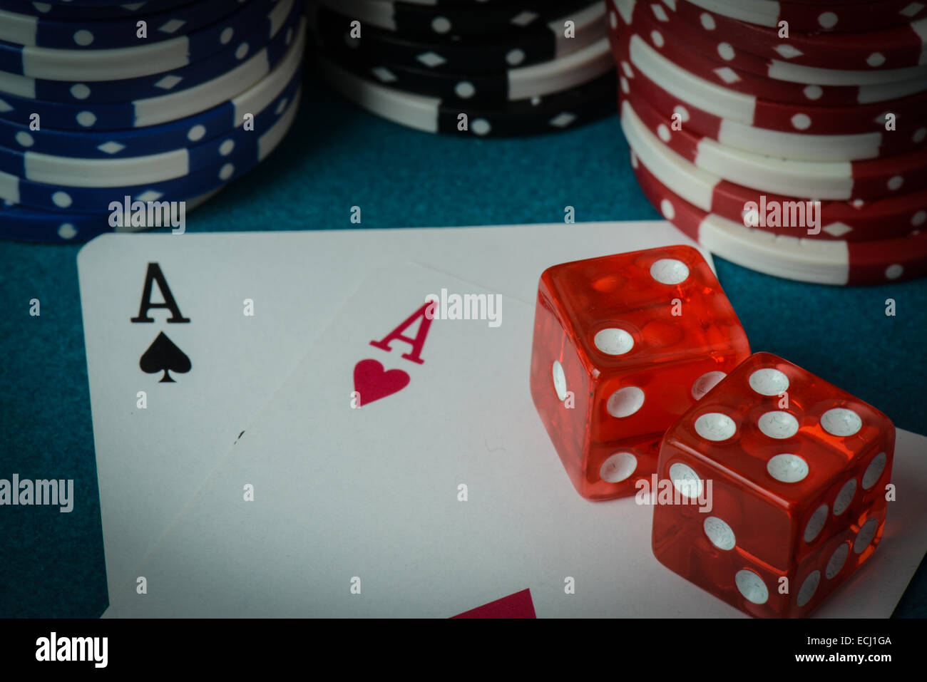 Playing Cards and Dice used with Gambling Chips Stock Photo