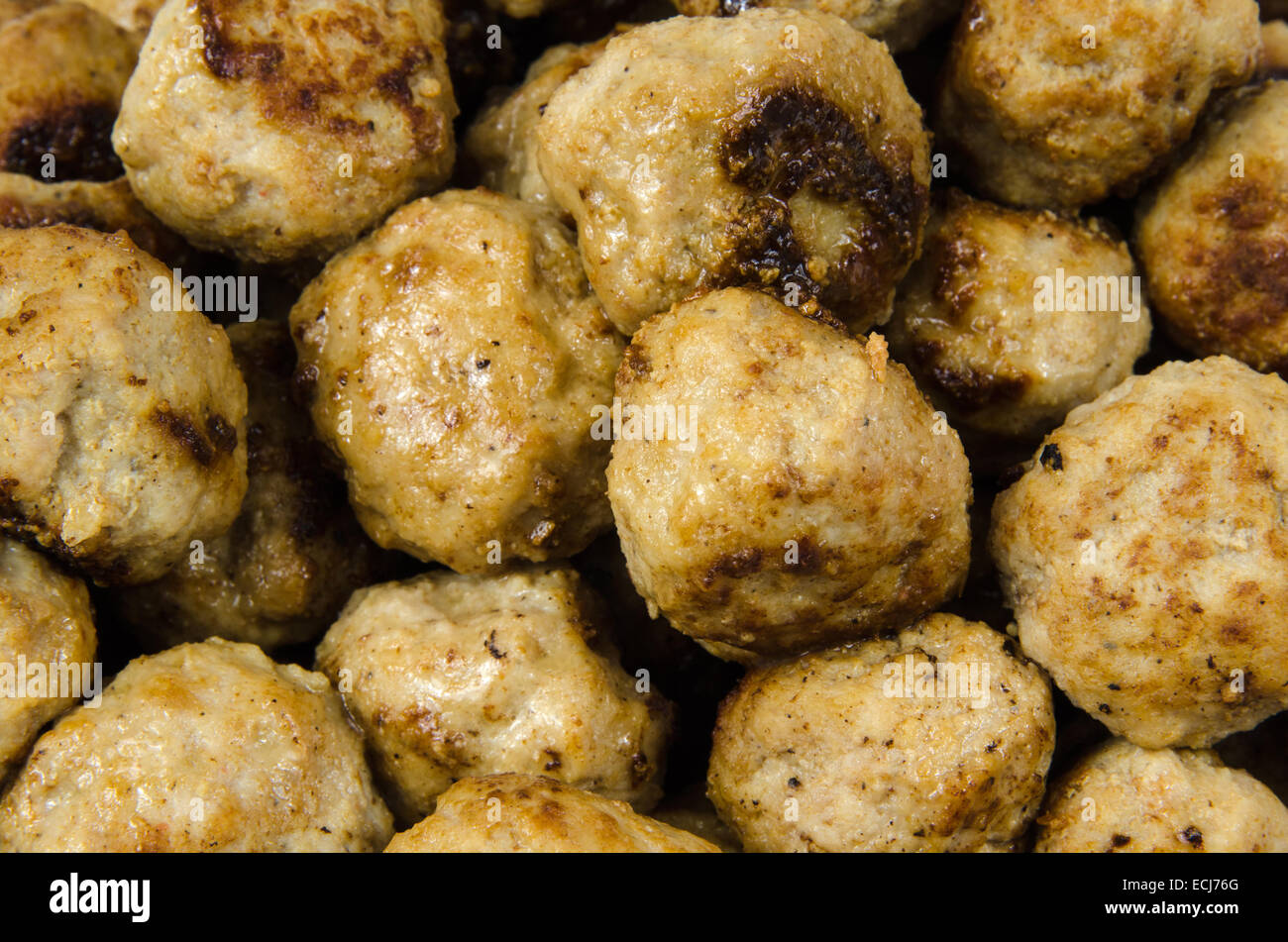 Closeup of newly fried meatballs all over Stock Photo
