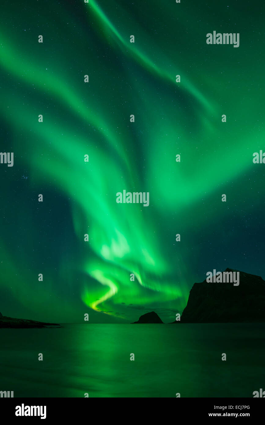 Northern Lights - Aurora Borealis shine in Sky over Vik Beach, Vestvågøy, Lofoten Islands, Norway Stock Photo