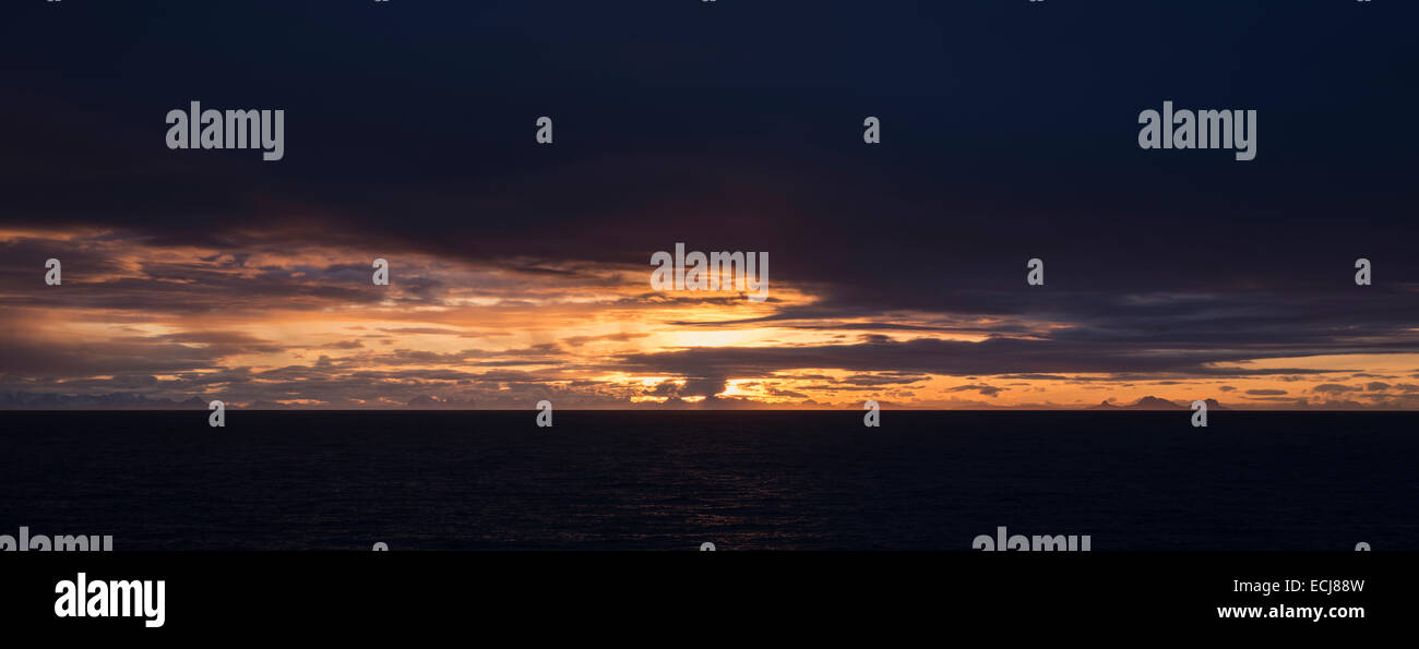 Dark Winter sunrise over Vestfjord, Reine, Moskenesøy, Lofoten Islands, Norway Stock Photo