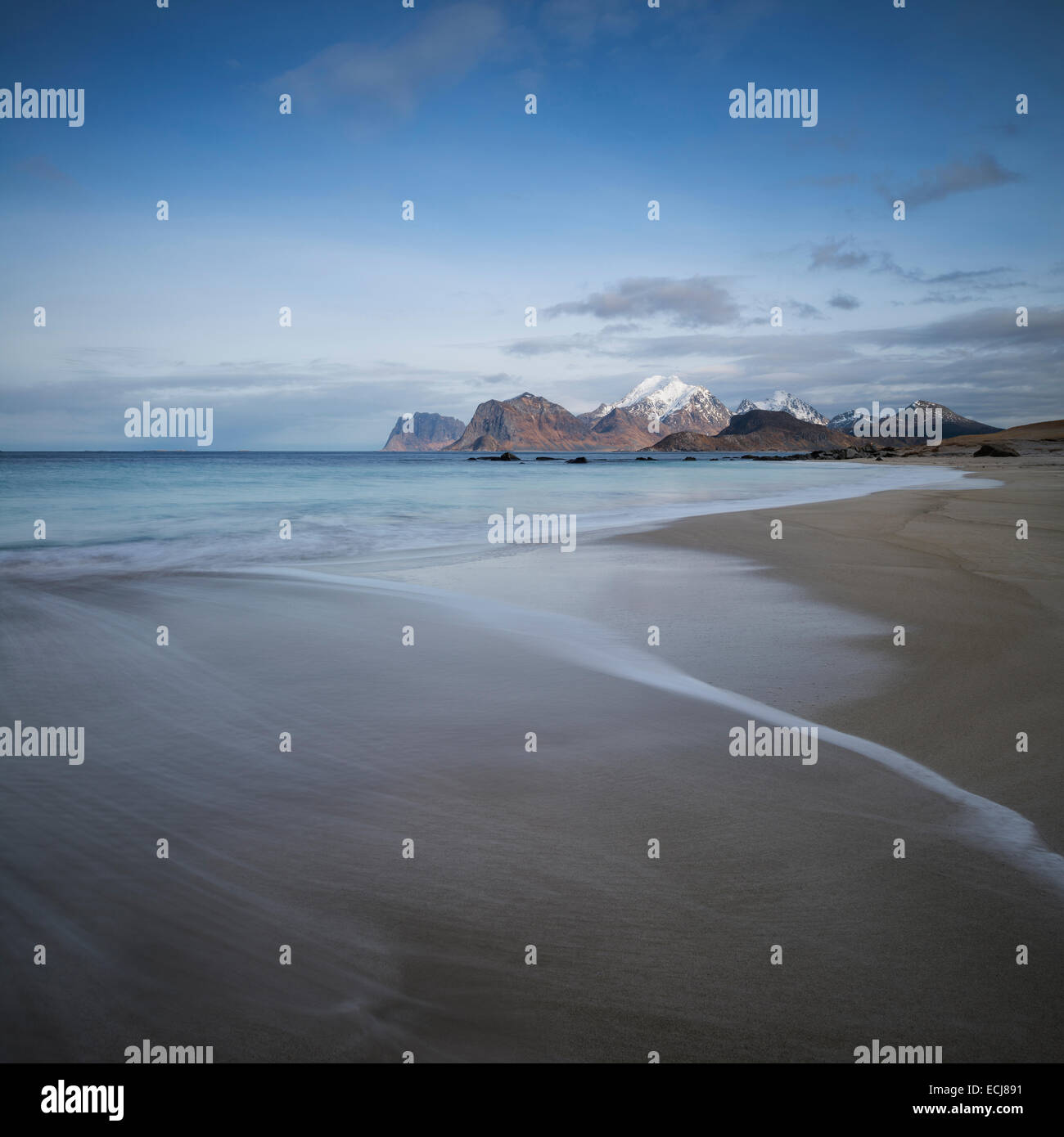 Waves wash over soft sands at Storsandnes beach, Flakstadøy, Lofoten Islands, Norway Stock Photo