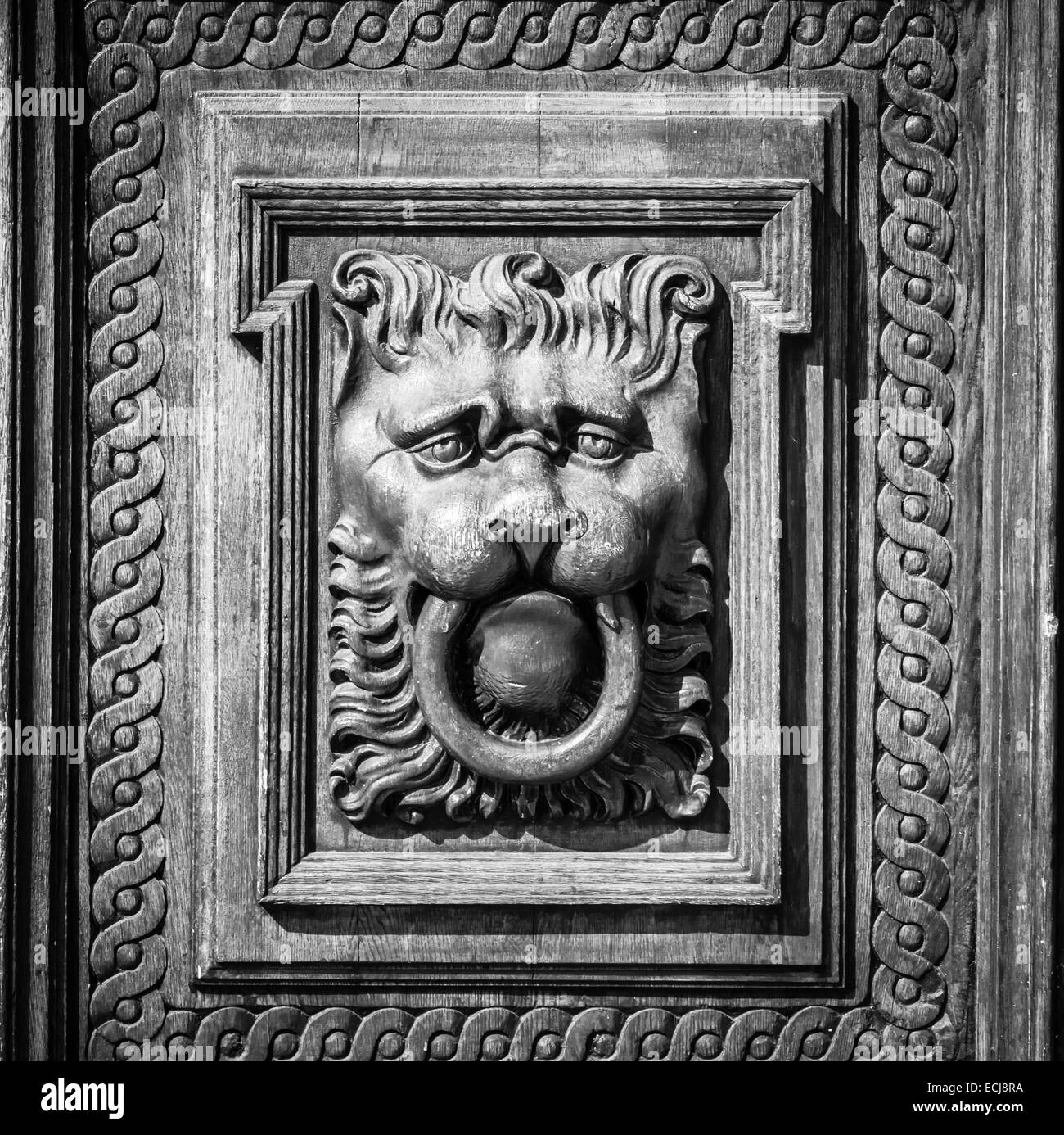 Woodcarving. Decoration vintage gate of the Old Town Hall. Prague. Black and white. Vignetting. Stylization. Stock Photo