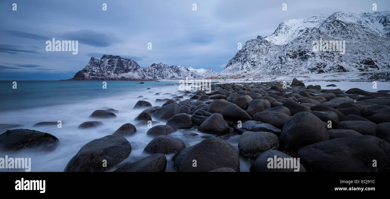 Waves wash over coastal rocks at Uttakleiv beach, Vestvågøy, Lofoten Islands, Norway Stock Photo