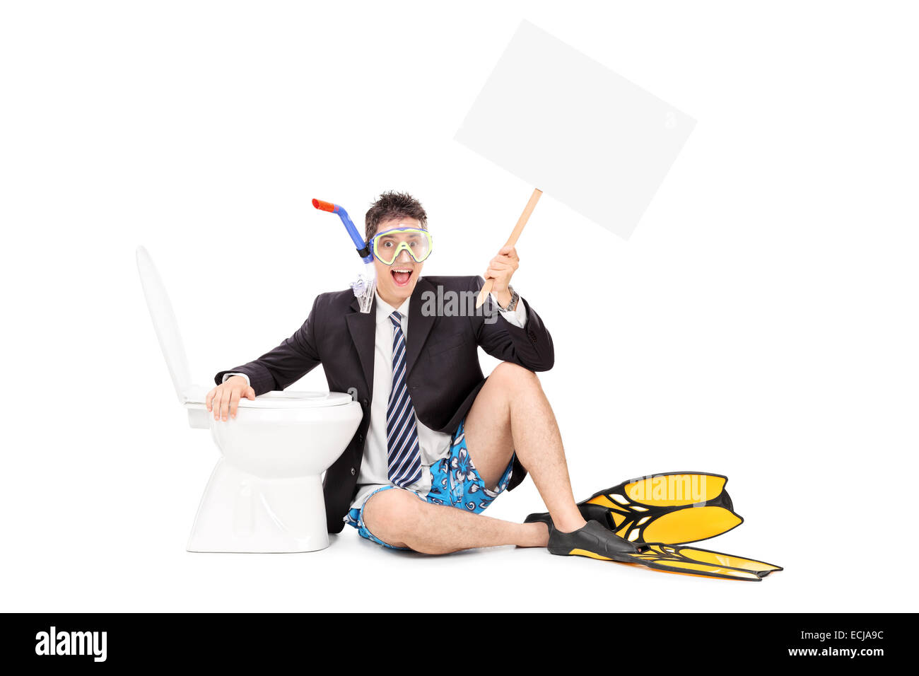 Man with snorkel holding a banner by a toilet isolated on white background Stock Photo
