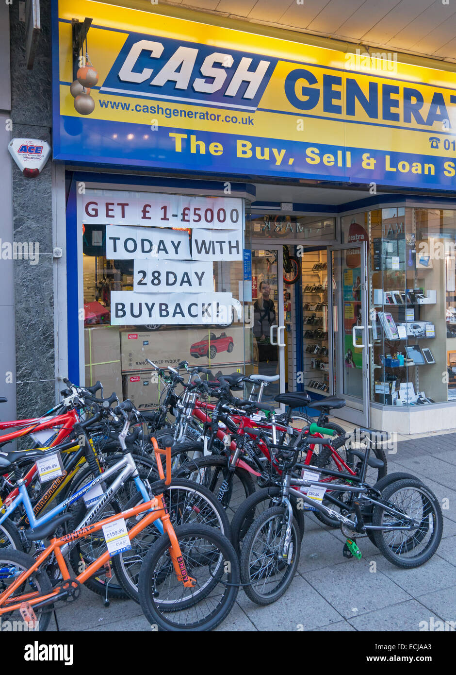 Cash Generator pawn shop with Xmas bikes for sale and 28 day buyback notice Sunderland, north east England, UK Stock Photo