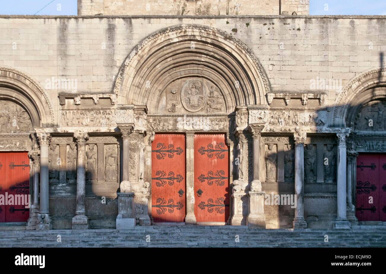 France, Gard, Saint Gilles, 12th-13th century abbey, listed as World Heritage by UNESCO under the road to St Jacques de Compostela in France, Provencal Romanesque style, central portal, tympanum, Christ in majesty surrounded by symbols of the four evangel Stock Photo