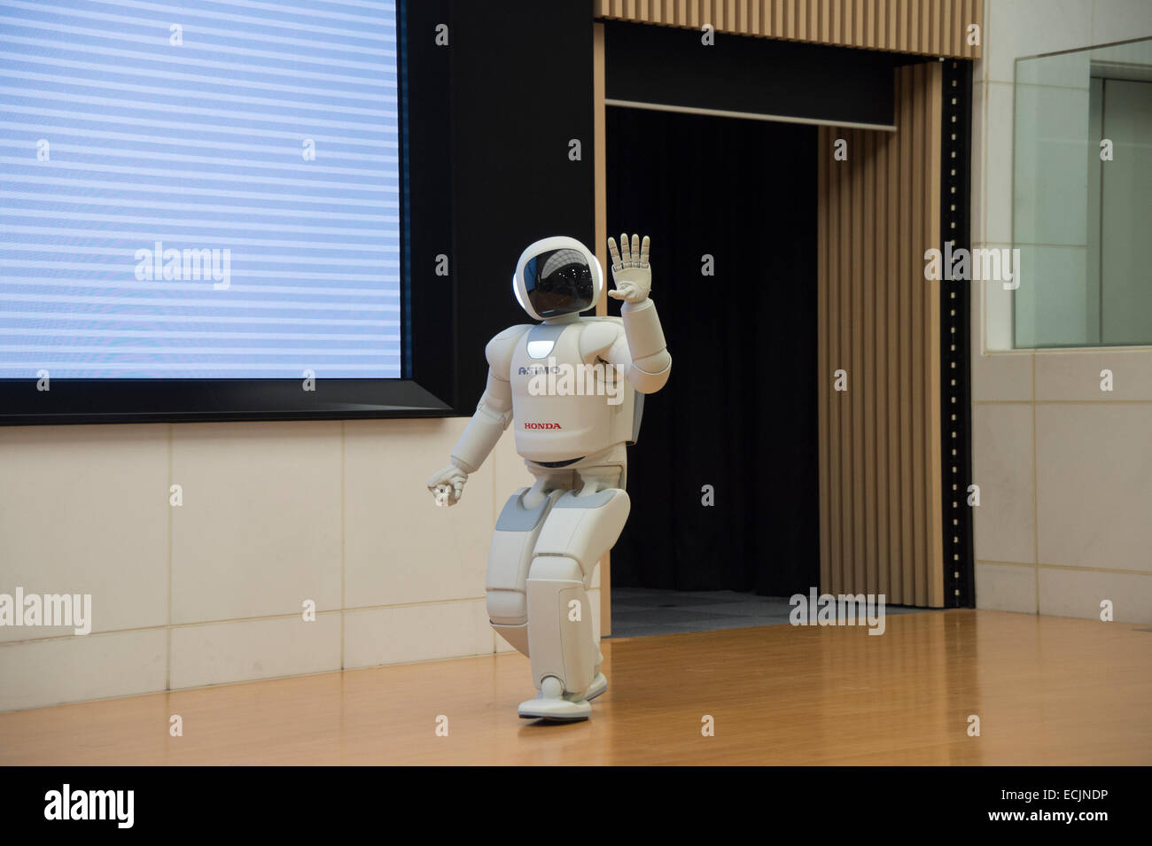 The robot Asimo performing at a meet and greet session at Honda HQ, Tokyo, Japan. Stock Photo
