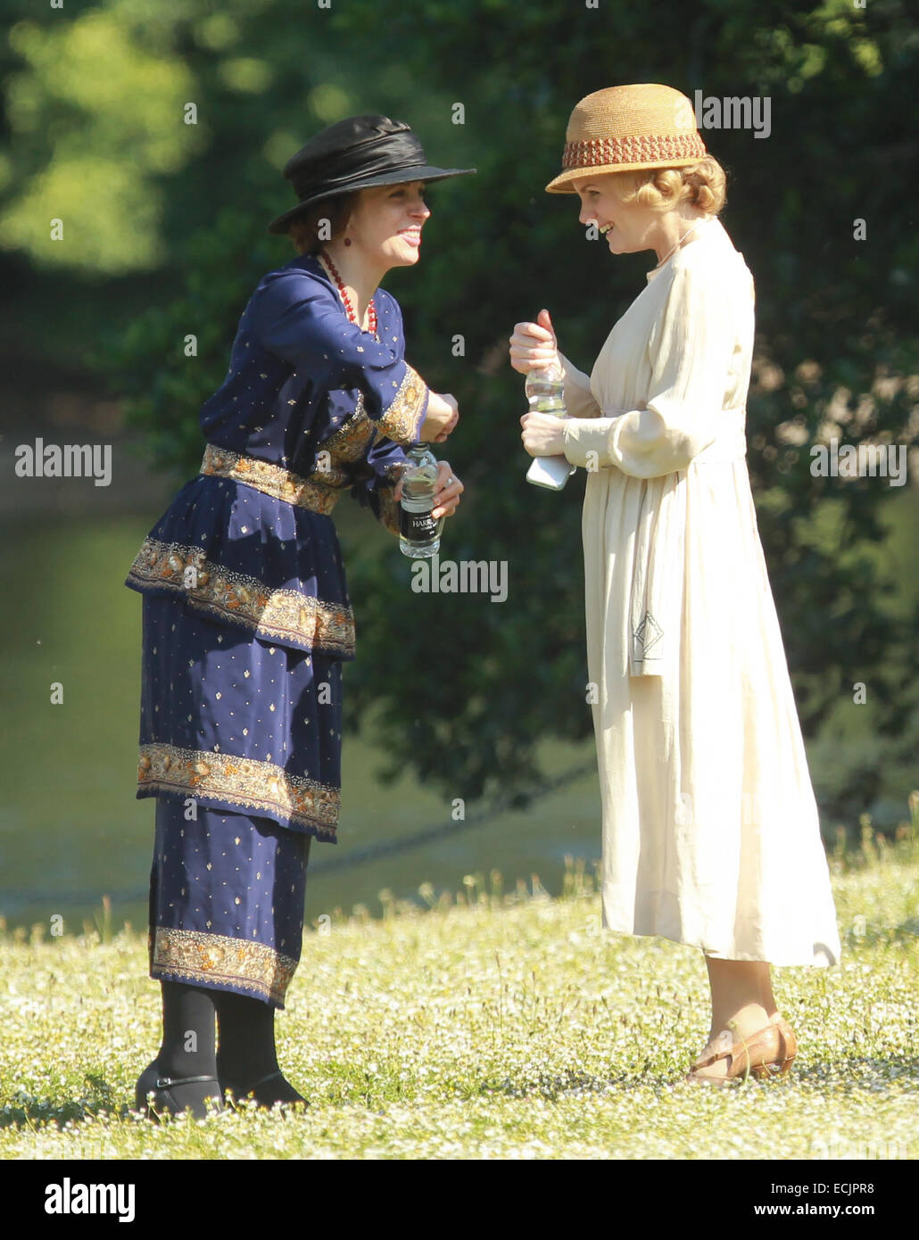 Amanda Abbington and Lauren Crace film a scene for Mr Selfridge in a London park  Featuring: Amanda Abbington,Lauren Crace Where: London, United Kingdom When: 13 Jun 2014 Stock Photo