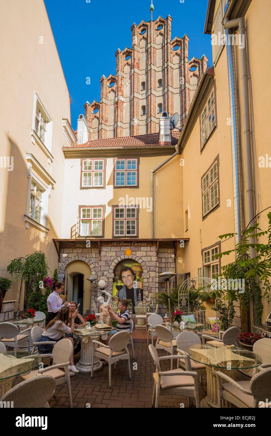 Latvia (Baltic States), Riga, European capital of culture 2014, historical centre listed as World Heritage by UNESCO, old town, Felicita restaurant street Skarnu and Saint Jhon's church Stock Photo