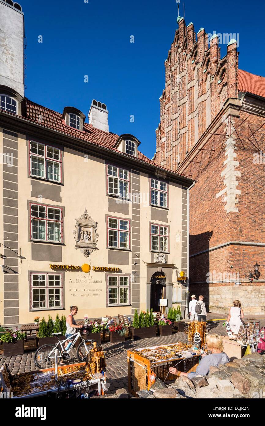 Latvia (Baltic States), Riga, European capital of culture 2014, historical centre listed as World Heritage by UNESCO, old town, Felicita restaurant street Skarnu and Saint Jhon's church Stock Photo