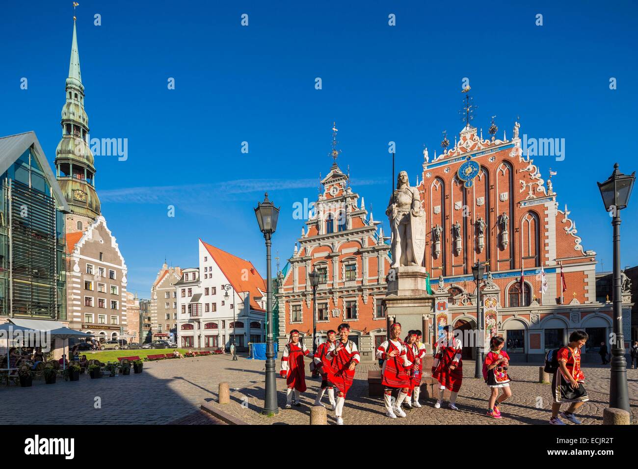 Latvia (Baltic States), Riga, European capital of culture 2014, historical centre listed as World Heritage by UNESCO, Ratslaukums square, the house of the blackheads, view of Saint Peter's Lutheran Church Stock Photo