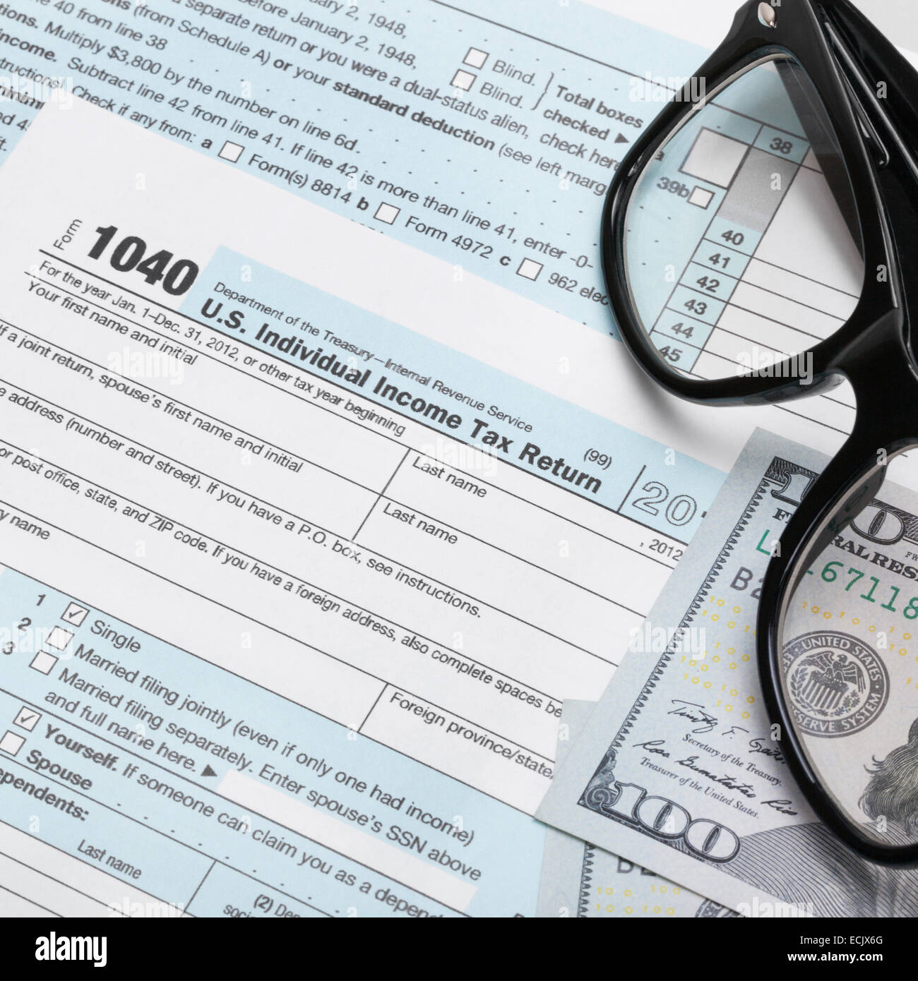 USA 1040 Tax Form with glasses and 100 US dollar bills Stock Photo - Alamy