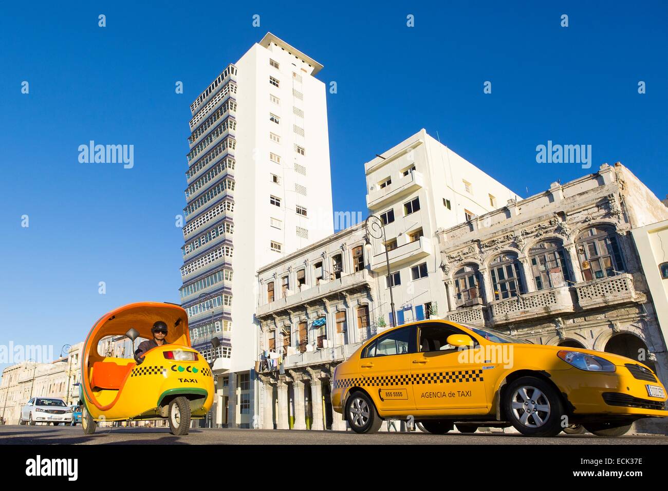 Cuba, La Habana, taxi and coco taxi on the Malecon Stock Photo