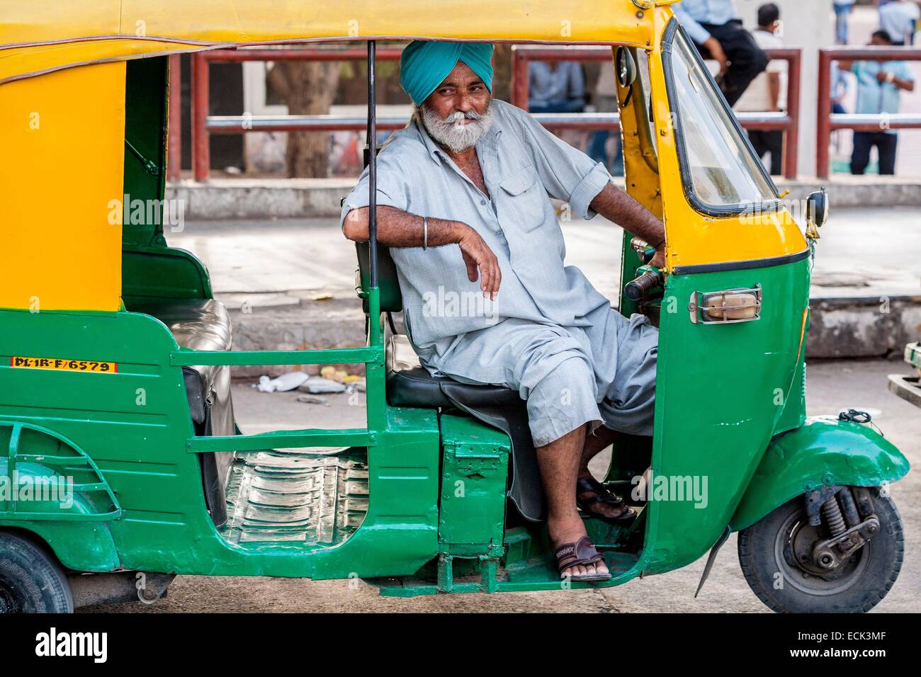 India, New Delhi, Connaught Place, motorized rickshaw driver Stock Photo