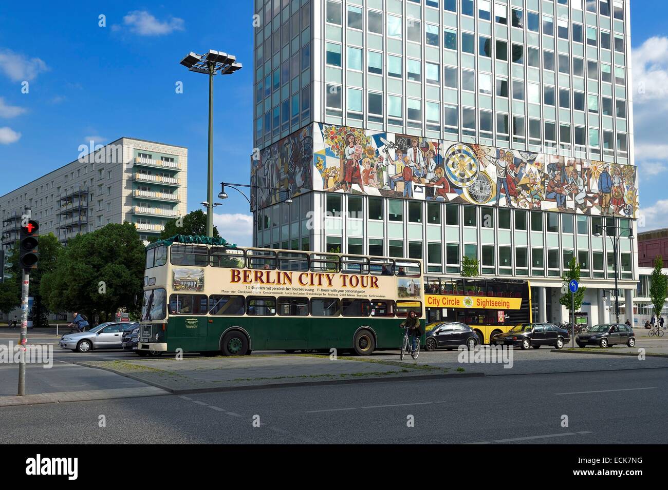 Germany, Berlin, Karl-Marx Allee, Haus des Lehrers (House of the teachers), the mural wrapping around the entire building designed in the style of Mexican mural art by artist Walter Womacka is titled Unser Leben (Our Life) and depicts various occupational Stock Photo